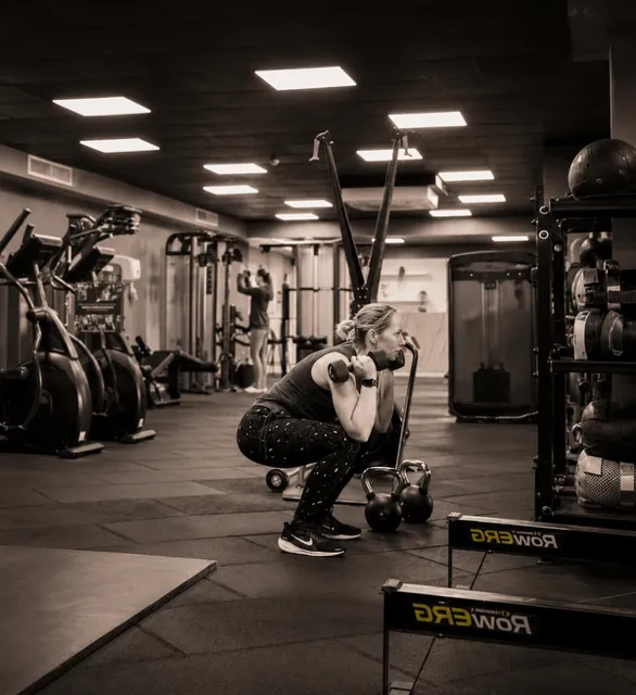 A woman training with weights at Hormone Intelligence